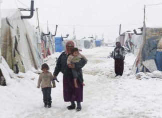 REPORT : Fango e fumo – l’inverno nei campi profughi