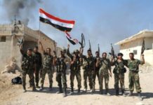 Syrian troops forces fighting ISIL to reach the Iraqi border for the first time since 2015