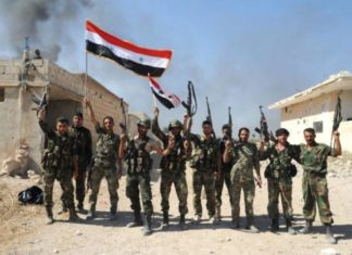 Syrian troops forces fighting ISIL to reach the Iraqi border for the first time since 2015