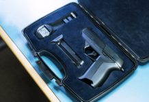 Researcher hacking, unlocking a smart gun with $15 magnets
