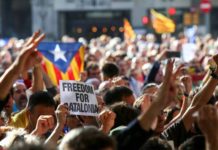 Spanish police storm Catalan government buildings to stop independence referendum