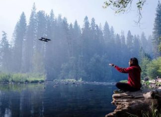 Video-capturing drone tracks moving subjects while freely navigating any environment