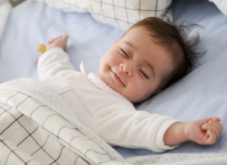 Feeding babies solid foods early may help them to sleep better