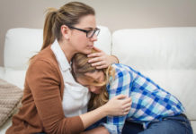 The age at which young women experience their first menstrual bleeding is linked to the age at which their sons start puberty