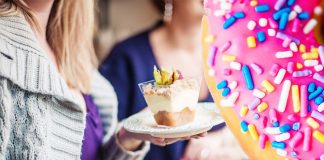 Why women with PMS often crave certain foods ?
