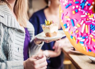 Why women with PMS often crave certain foods ?
