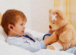 Why do some children on the autism spectrum experience a temporary reduction in behavioral symptoms when they have a fever ?