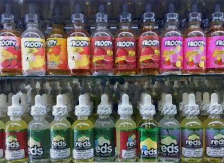 Common green apple flavorant farnesene enhances nicotine reward