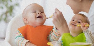 How can toddlers learn to spoon feed from caregivers ?