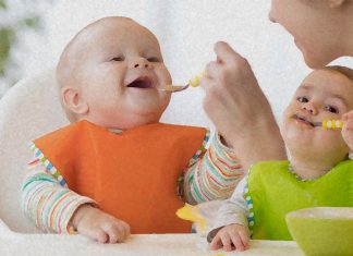 How can toddlers learn to spoon feed from caregivers ?